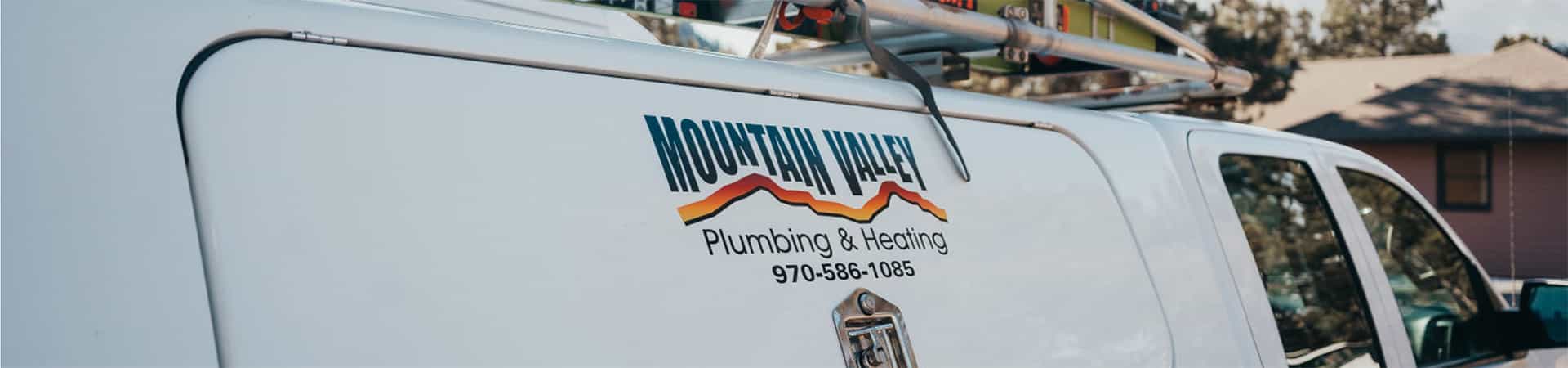mountain valley plumbing & Heating work truck with the company logo on the side of the truck.