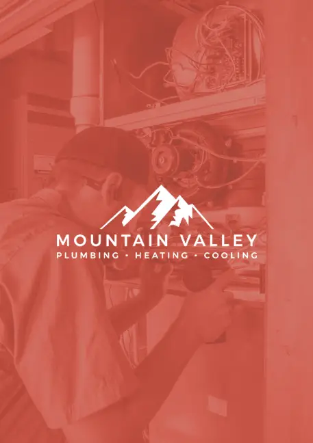 Mountain Valley Plumbing, Heating, and Cooling branded graphic with a technician servicing HVAC equipment in the background.